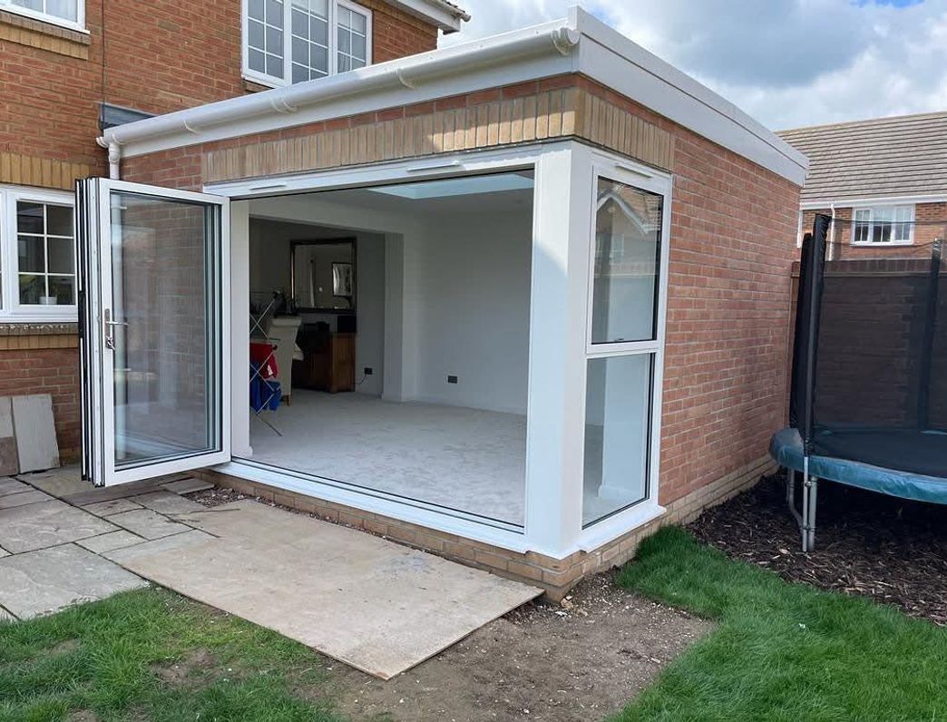 A modern and cosy outdoors entertainement area by Clarke's Construction in Andover.