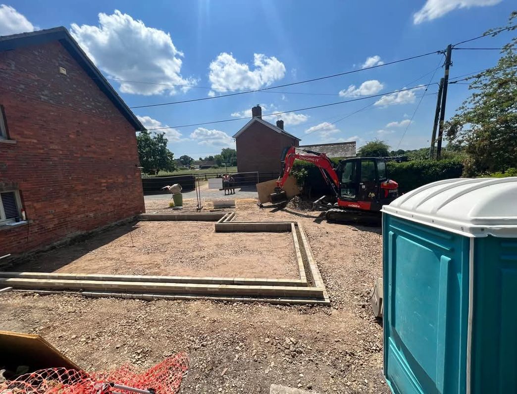 Freshly dug trench, exposing pipes, carried out by Clarke's Construction in Andover.