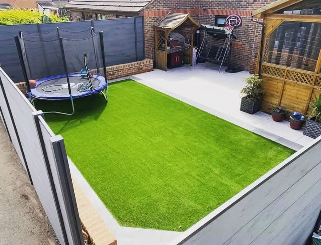 A modern patio and lawn maintained by Clarke's Construction in Andover.